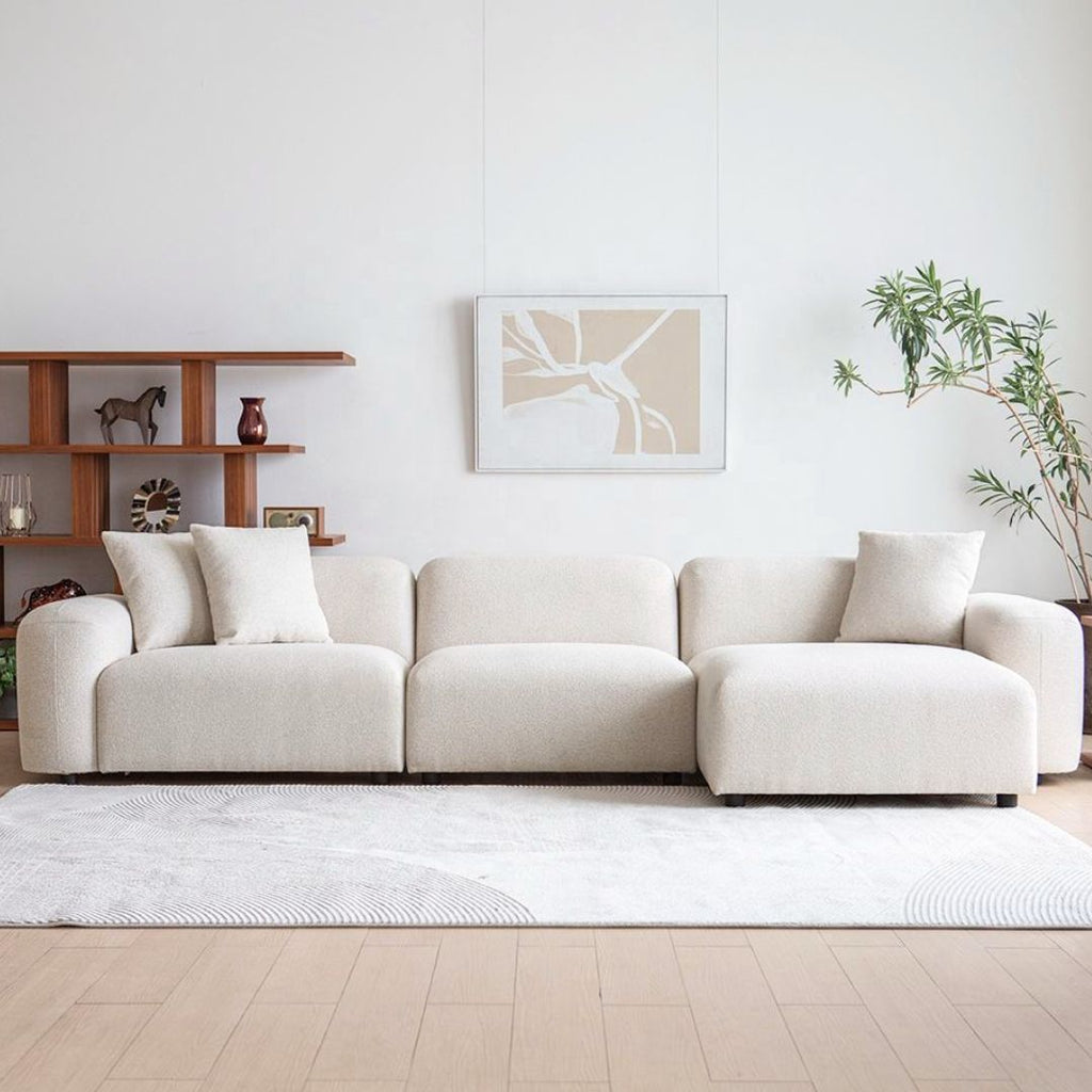 Modulær sjeselongsofa i lyst bouclé-tekstil